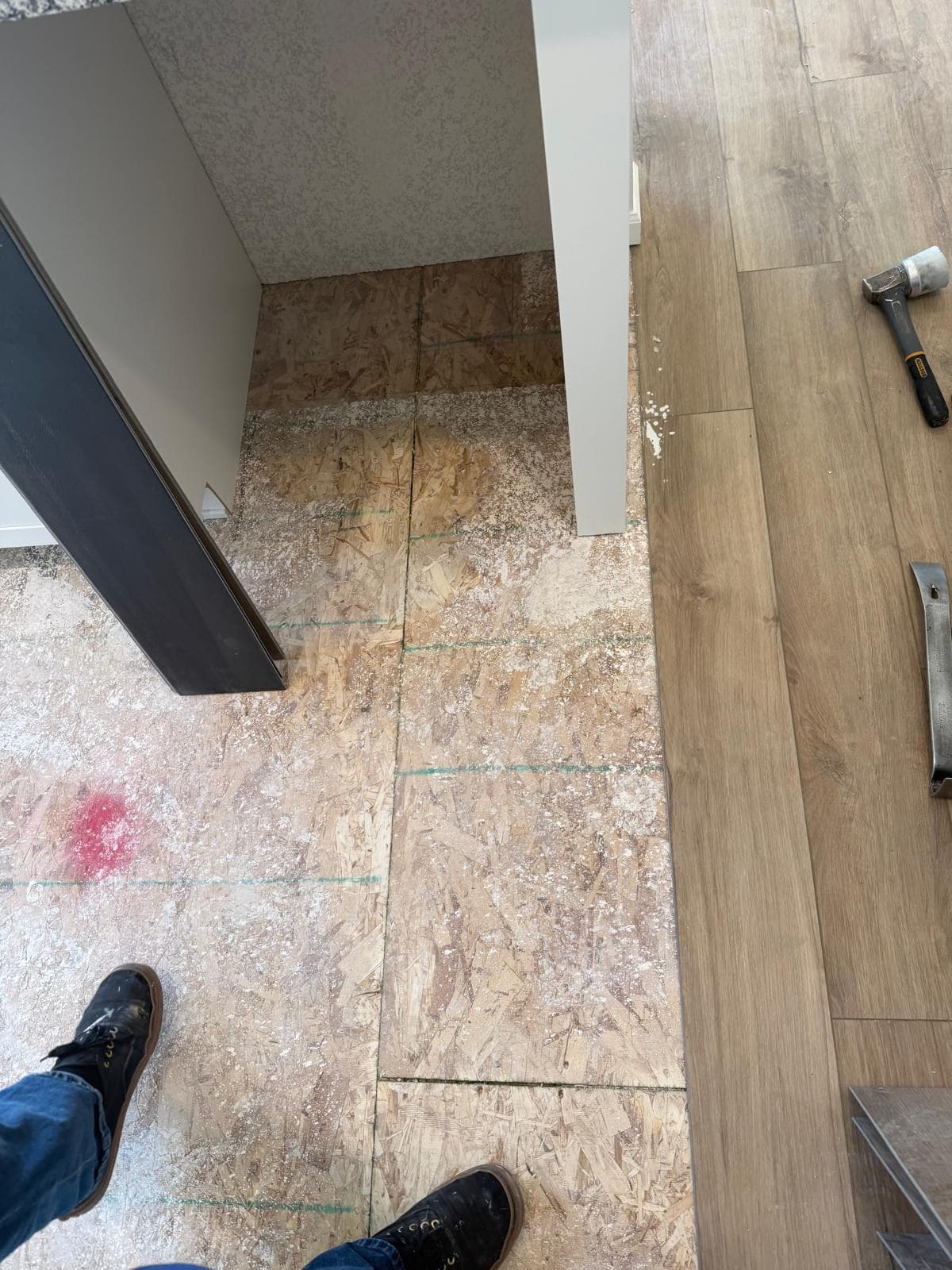 Subfloor preparation with OSB and chalk layout lines